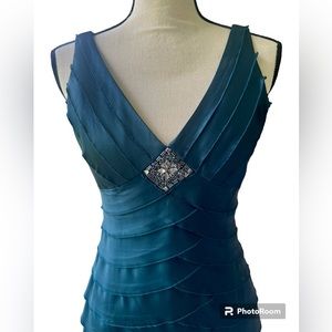 Turquoise pleated sleeveless dress with beaded embellishment